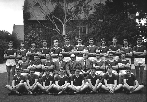 Athletics Team 1957, Don is seated at front (third from right) and Don Macmillan is seated behind him (fourth from right)